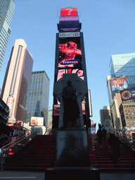 Statue of Father Duffy and red steps at Times Square