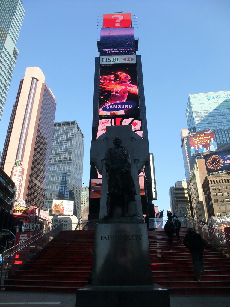 Statue of Father Duffy and red steps at Times Square