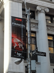 Road signs at the crossing of Wall Street and Nassau Street