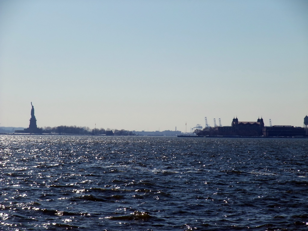 Liberty Island with the Statue of Liberty, and Ellis Island with the Ellis Island Immigration Museum, viewed from the Battery Park City Esplanade