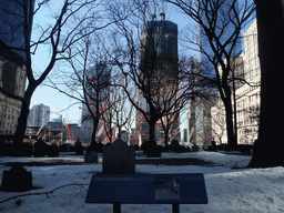 The Churchyard of Saint Paul`s Chapel and One World Trade Center building and the National September 11 Memorial & Museum, under construction