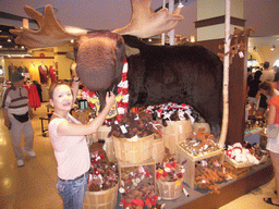 Miaomiao with a plush moose, in a Niagara Falls shop