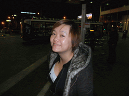 Miaomiao at the bus station of Nice Côte d`Azur Airport, by night