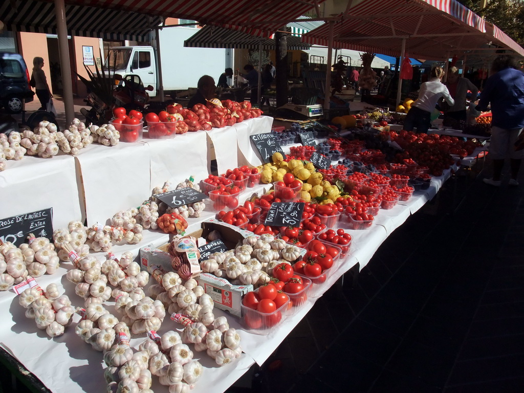 Market stall with garlic and fruits at the Marché aux Fleurs market at the Cours Saleya street, at Vieux-Nice