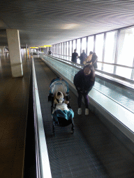Miaomiao and Max on a moving walkway at Schiphol Airport