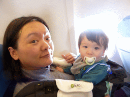 Miaomiao and Max on the airplane from Amsterdam