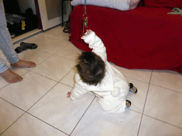 Max playing with keys on the floor of the living room of our holiday home `Maisonnette`