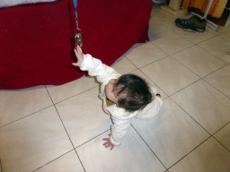 Max playing with keys on the floor of the living room of our holiday home `Maisonnette`