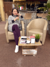 Miaomiao having a drink at the terrace of the La Shounga bar at the Place Guynemer square