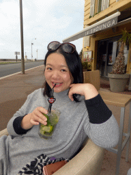 Miaomiao having a drink at the terrace of the La Shounga bar at the Place Guynemer square