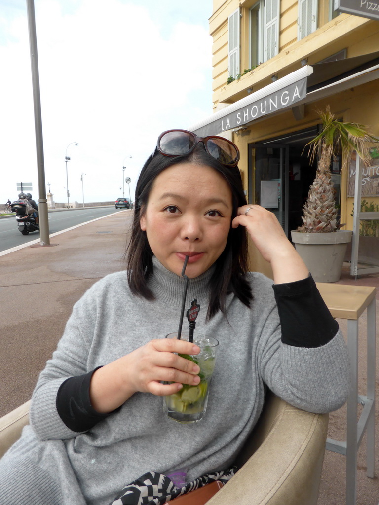 Miaomiao having a drink at the terrace of the La Shounga bar at the Place Guynemer square