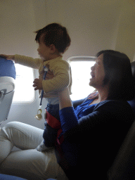 Miaomiao and Max in the airplane to Amsterdam