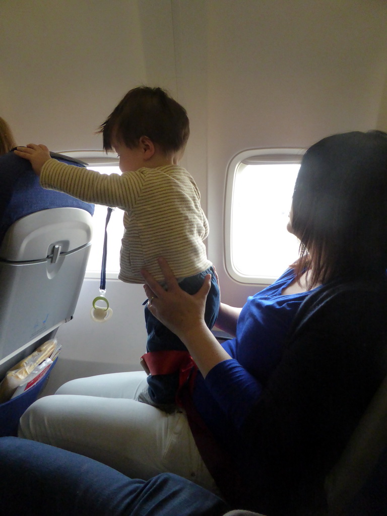 Miaomiao and Max in the airplane to Amsterdam