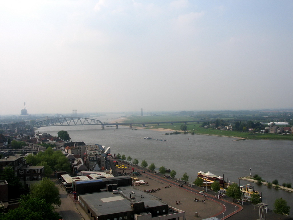 The Waalkade street and the Nijmegen railway bridge over the Waal river, viewed from the replica of the Donjon tower at the Valkhof park