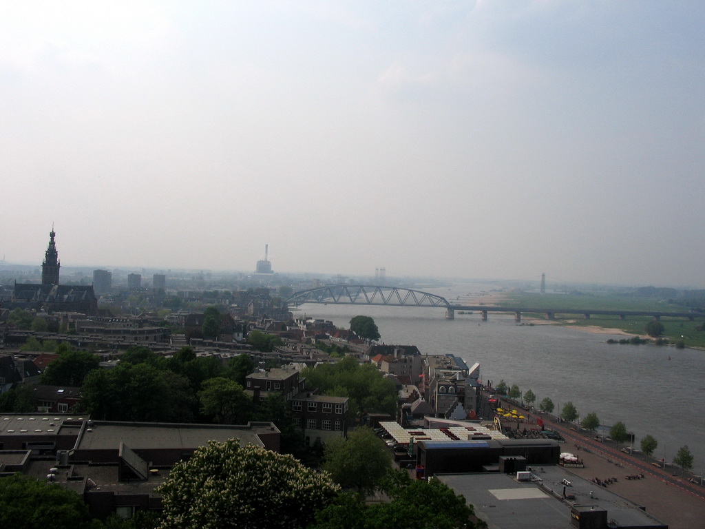 The city center with the Sint-Stevenskerk church, the Waalkade straat and the Nijmegen railway bridge over the Waal river, viewed from the replica of the Donjon tower at the Valkhof park
