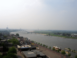 The Waalkade street and the Nijmegen railway bridge over the Waal river, viewed from the replica of the Donjon tower at the Valkhof park