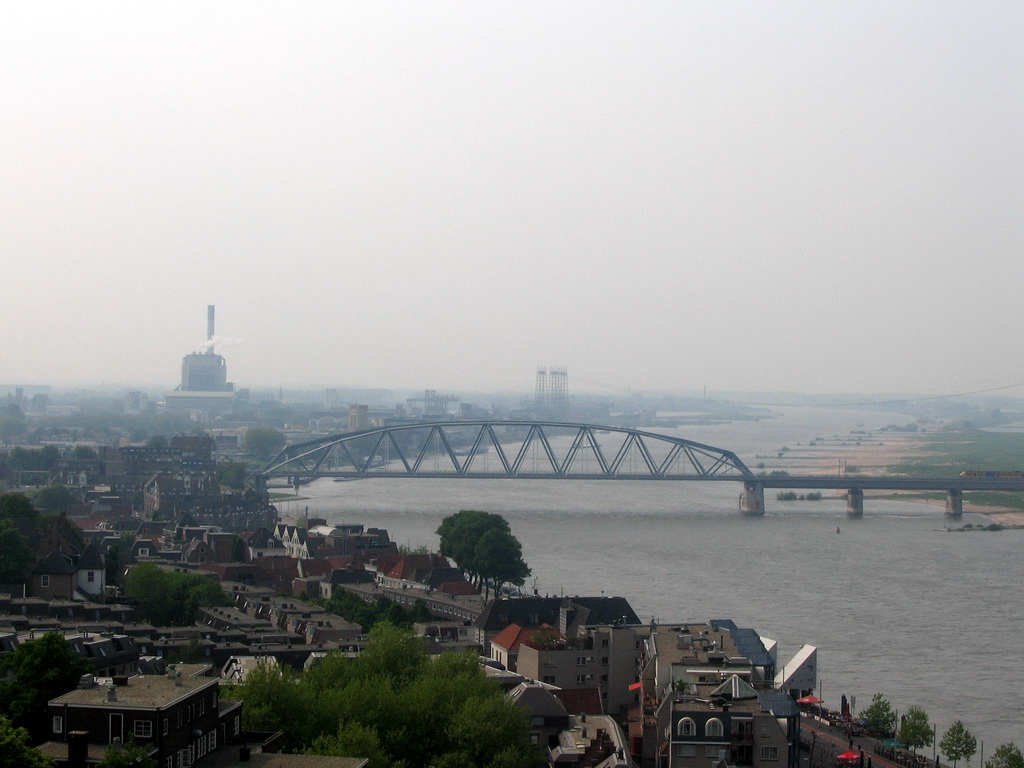 The Waalkade street and the Nijmegen railway bridge over the Waal river, viewed from the replica of the Donjon tower at the Valkhof park