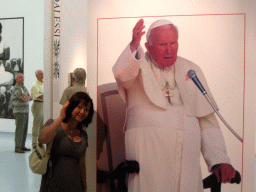 Miaomiao with a photograph of Pope John Paul II at the Valkhof museum