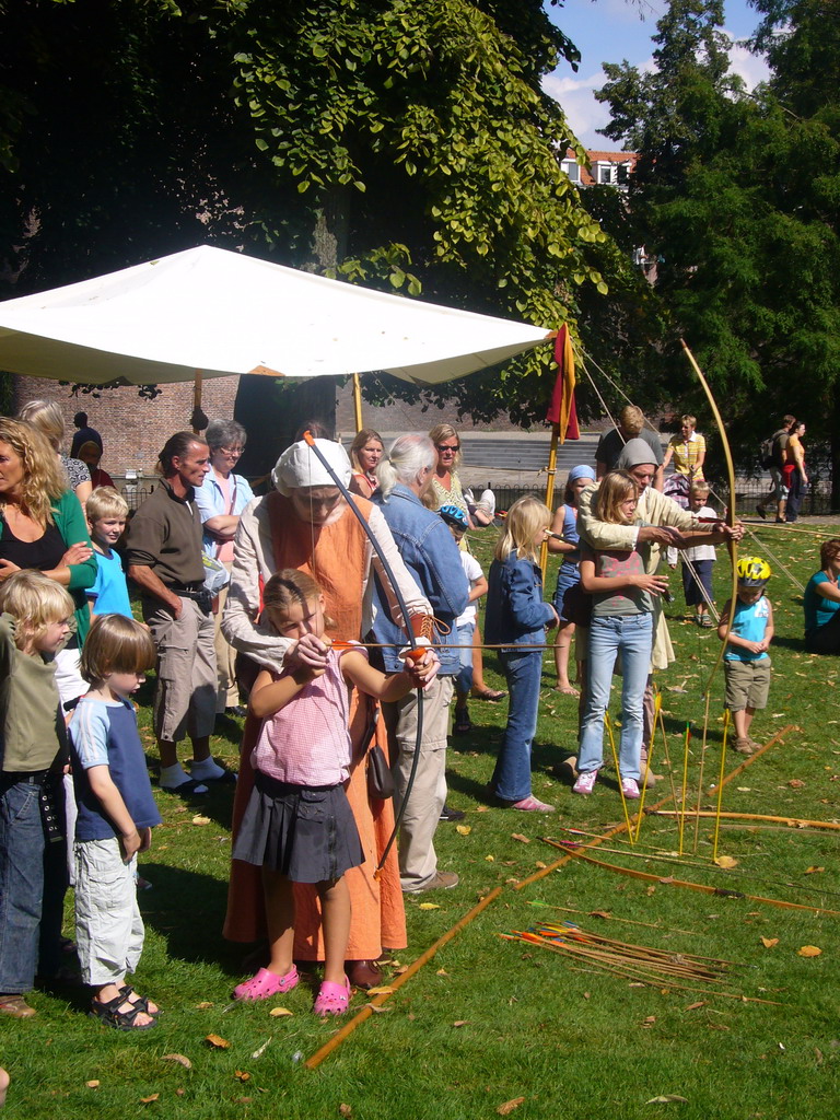 People shooting arrows at the Kronenburgerpark, during the Gebroeders van Limburg Festival