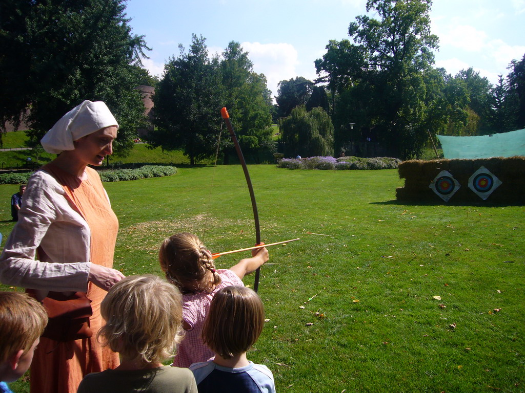 People shooting arrows at the Kronenburgerpark, during the Gebroeders van Limburg Festival