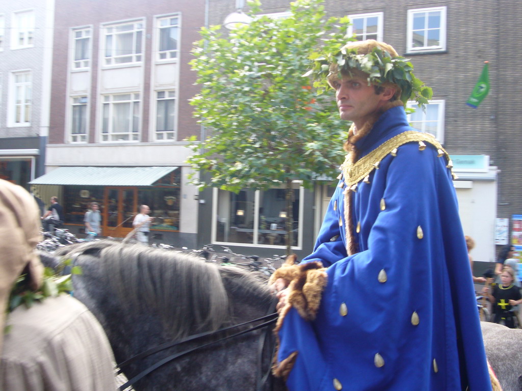 Person in medieval clothes on a horse at the Ganzenheuvel square, during the Gebroeders van Limburg Festival