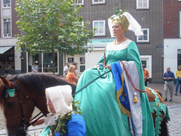 People in medieval clothes and a horse at the Ganzenheuvel square, during the Gebroeders van Limburg Festival