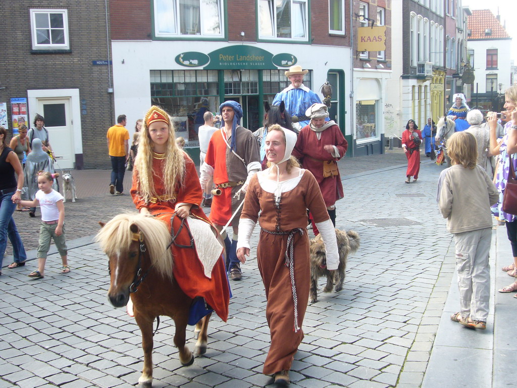 People in medieval clothes, horses and a falcon at the Ganzenheuvel square, during the Gebroeders van Limburg Festival