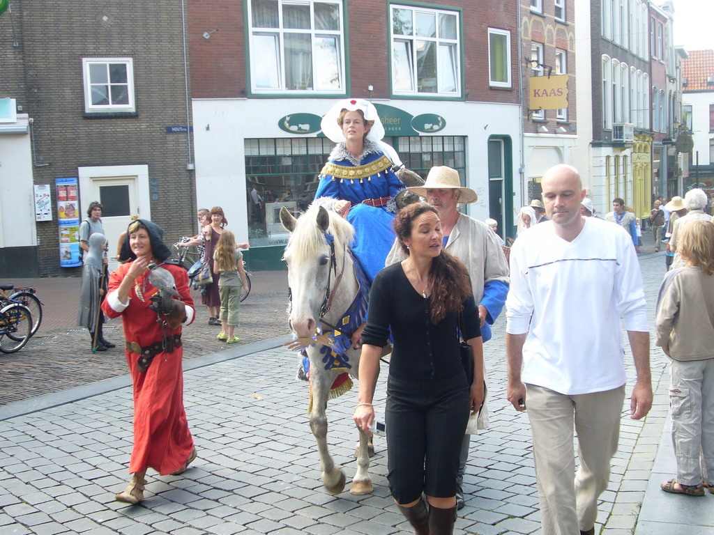 People in medieval clothes, a horse and falcons at the Ganzenheuvel square, during the Gebroeders van Limburg Festival