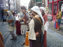 People dressed as medieval musicians at the Houtstraat street, during the Gebroeders van Limburg Festival