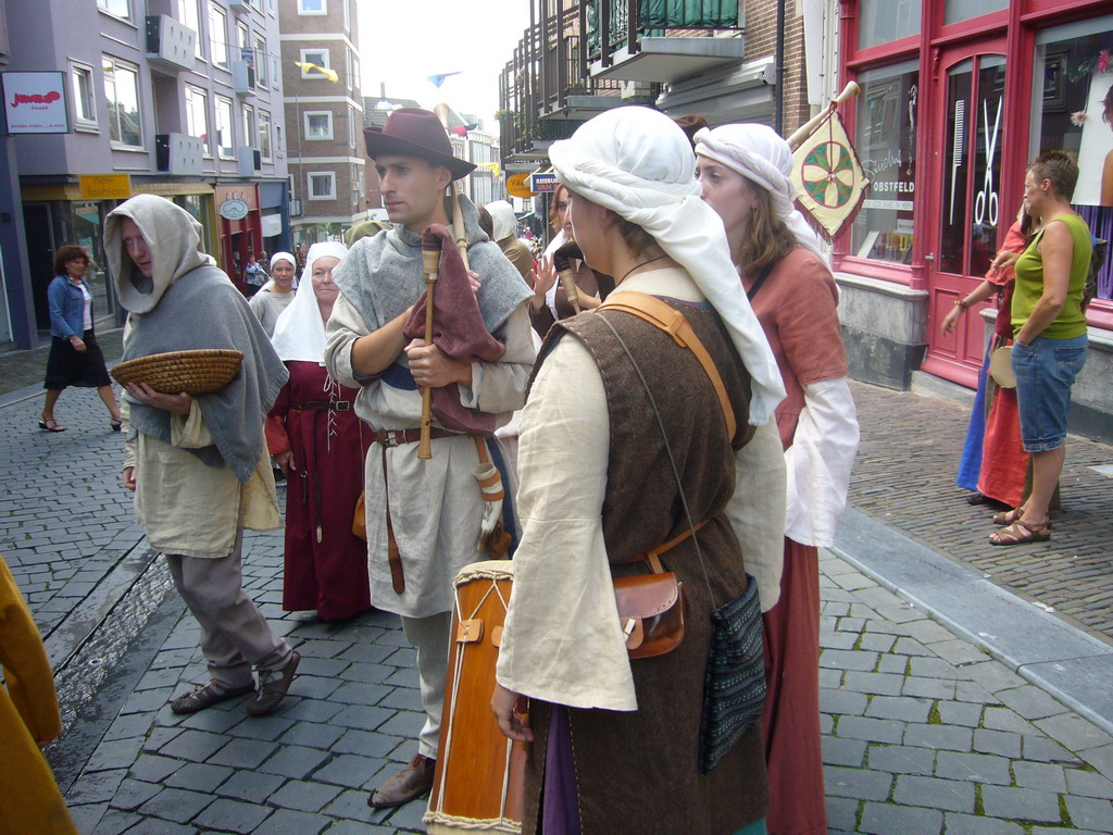 People dressed as medieval musicians at the Houtstraat street, during the Gebroeders van Limburg Festival