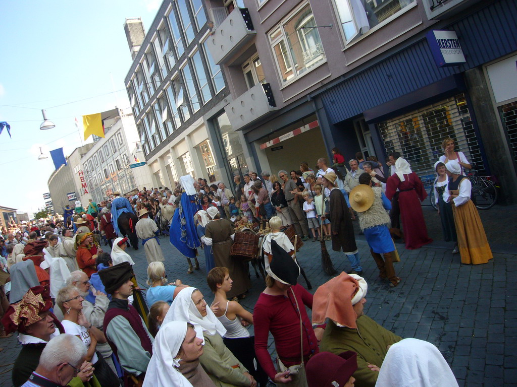 People in medieval clothes and horses at the Houtstraat street, during the Gebroeders van Limburg Festival