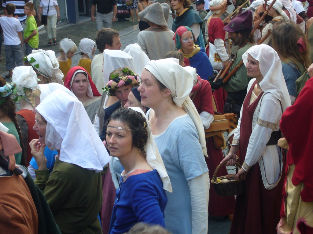 People in medieval clothes at the Houtstraat street, during the Gebroeders van Limburg Festival