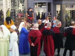 People in medieval clothes at the Houtstraat street, during the Gebroeders van Limburg Festival