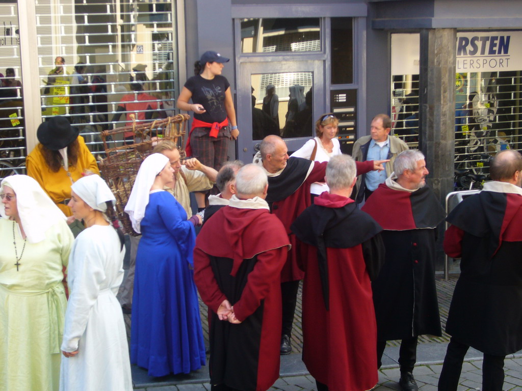 People in medieval clothes at the Houtstraat street, during the Gebroeders van Limburg Festival