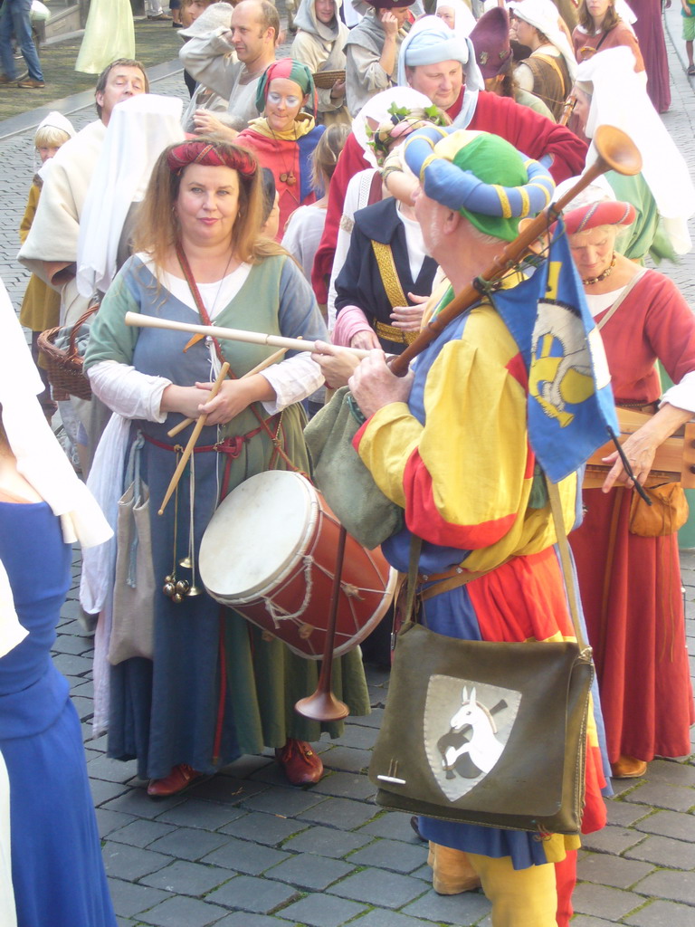 People dressed as medieval musicians at the Houtstraat street, during the Gebroeders van Limburg Festival