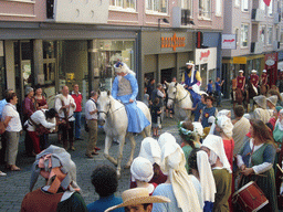 People in medieval clothes and horses at the Houtstraat street, during the Gebroeders van Limburg Festival