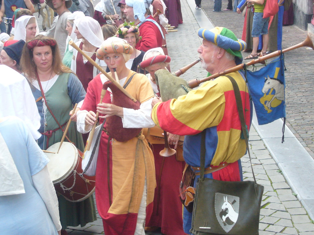 People dressed as medieval musicians at the Houtstraat street, during the Gebroeders van Limburg Festival