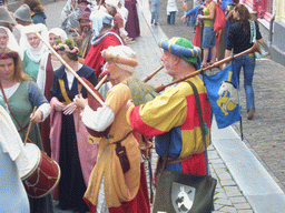 People dressed as medieval musicians at the Houtstraat street, during the Gebroeders van Limburg Festival