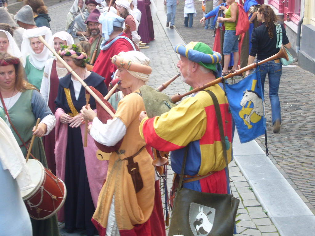 People dressed as medieval musicians at the Houtstraat street, during the Gebroeders van Limburg Festival