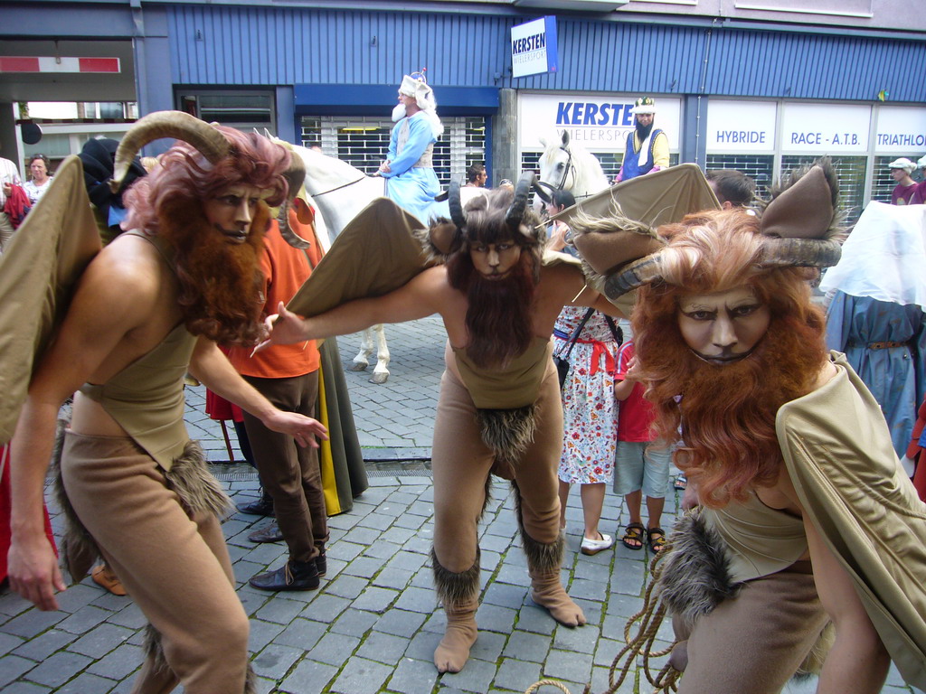 People dressed as mythological creatures at the Houtstraat street, during the Gebroeders van Limburg Festival