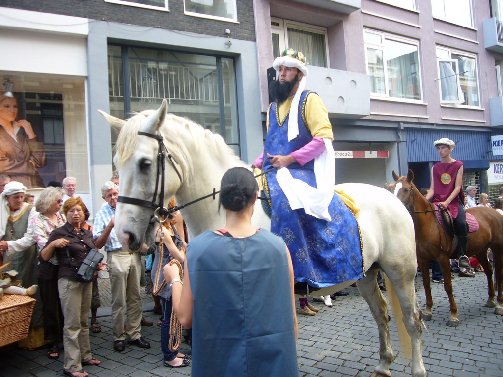 People in medieval clothes and horses at the Houtstraat street, during the Gebroeders van Limburg Festival