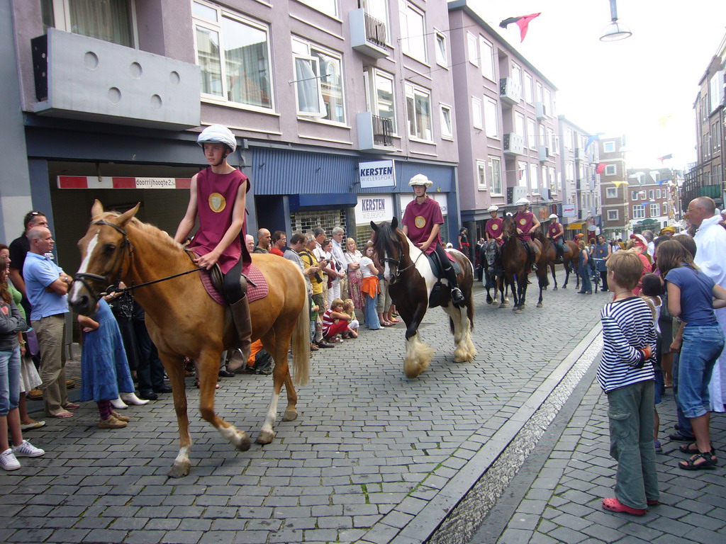 People in medieval clothes and horses at the Houtstraat street, during the Gebroeders van Limburg Festival