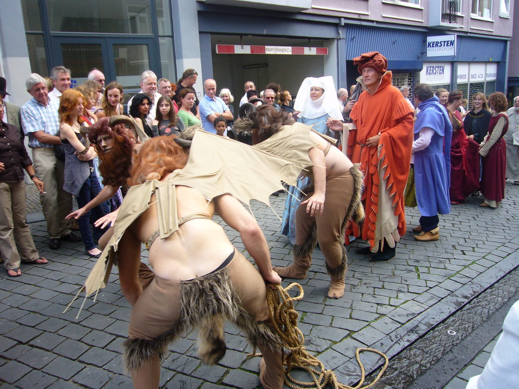 People dressed as mythological creatures at the Houtstraat street, during the Gebroeders van Limburg Festival