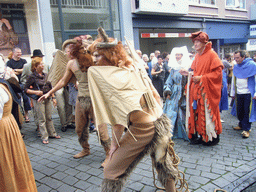 People dressed as mythological creatures at the Houtstraat street, during the Gebroeders van Limburg Festival