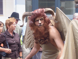Person dressed as a mythological creature at the Houtstraat street, during the Gebroeders van Limburg Festival