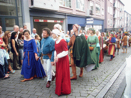 People in medieval clothes at the Houtstraat street, during the Gebroeders van Limburg Festival