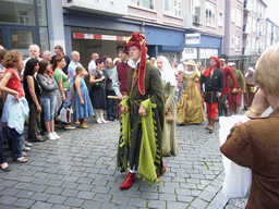 People in medieval clothes at the Houtstraat street, during the Gebroeders van Limburg Festival