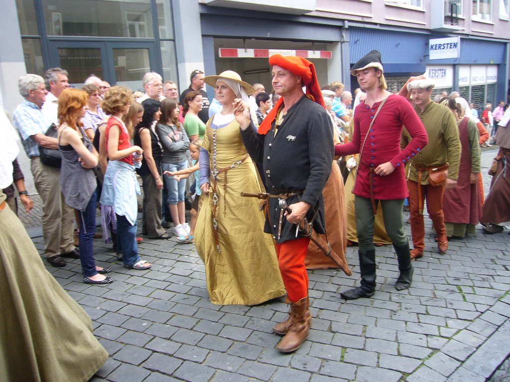 People in medieval clothes at the Houtstraat street, during the Gebroeders van Limburg Festival