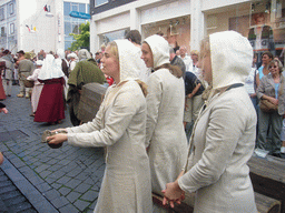 People in medieval clothes at the Houtstraat street, during the Gebroeders van Limburg Festival