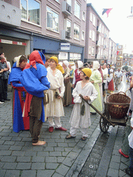 People in medieval clothes at the Houtstraat street, during the Gebroeders van Limburg Festival